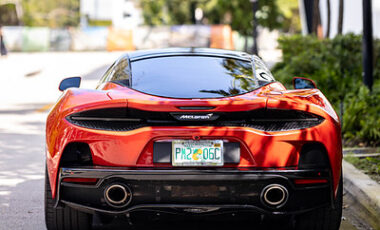 McLaren GT Red on Peanut Butter exotic rental cars yacht charters Miami