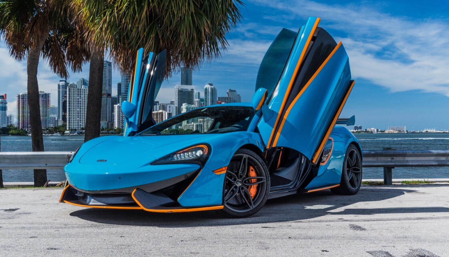 Mclaren 570s Coupe Blue and Orange on Orange exotic rental cars yacht charters Miami